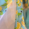 Kitchen Towel Bee Zesty Toss Lemons on Lt Blue Overall Print